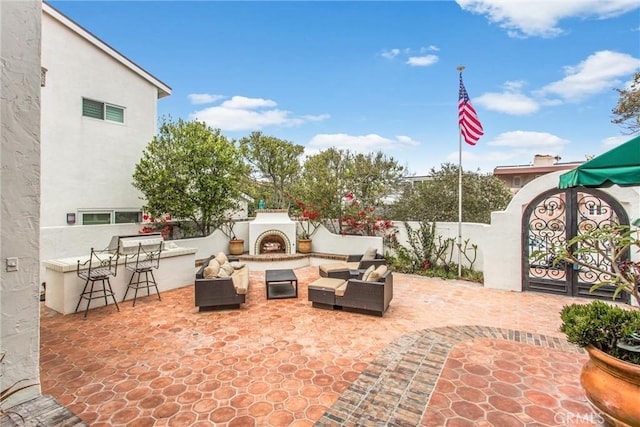1585 E Ocean Blvd, Newport Beach, CA 92661 - view of patio with an outdoor living space with a fireplace