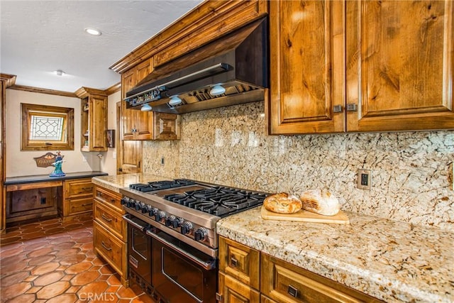 1585 E Ocean Blvd, Newport Beach, CA 92661 - kitchen with range with two ovens, wall chimney exhaust hood, brown cabinetry, tasteful backsplash, and crown molding
