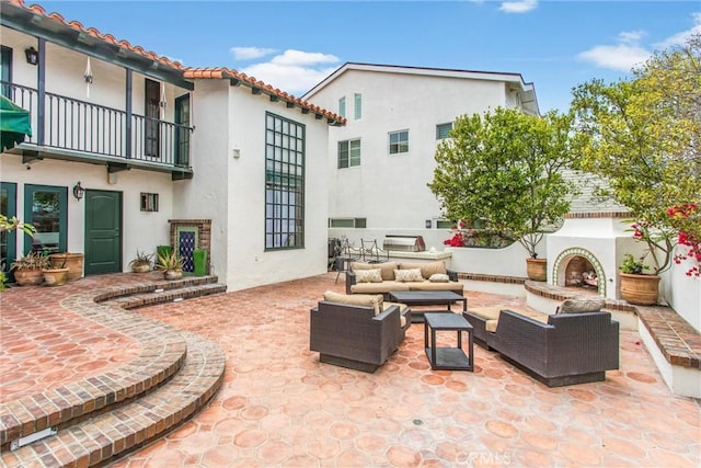 1585 E Ocean Blvd, Newport Beach, CA 92661 - patio / terrace featuring a patio and an outdoor living space with a fireplace