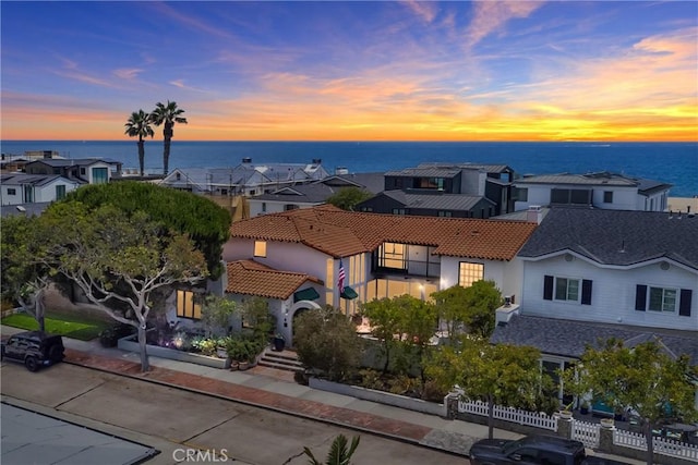1585 E Ocean Blvd, Newport Beach, CA 92661 - view of front of property featuring a water view, stucco siding, a tile roof, and a residential view