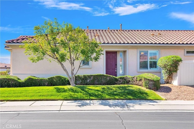 11170 Avonlea Rd, Apple Valley, CA 92308 - view of front of property featuring stucco siding, a front yard, and a tile roof