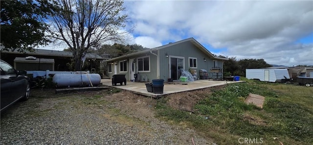 back of property featuring a patio area