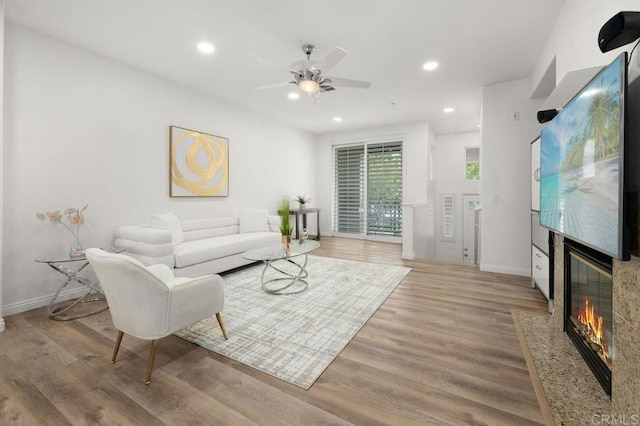 4918 Paramount Dr, San Diego, CA 92123 - living room featuring a high end fireplace, ceiling fan, wood finished floors, recessed lighting, and baseboards