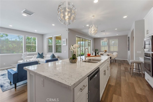 4530 E Langdon Dr, Anaheim Hills, CA 92807 - kitchen featuring a sink, appliances with stainless steel finishes, a chandelier, open floor plan, and wood finished floors