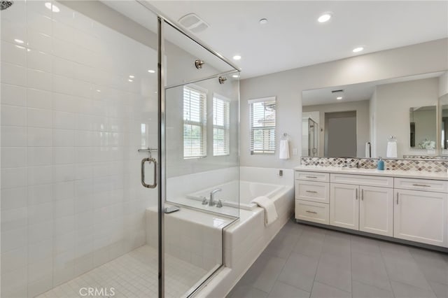 4530 E Langdon Dr, Anaheim Hills, CA 92807 - full bath featuring a bath, tile patterned floors, vanity, a stall shower, and decorative backsplash