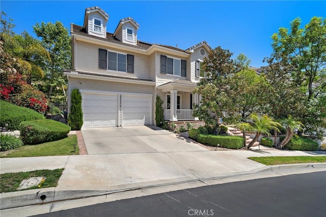 23478 Ridgeway, Mission Viejo, CA 92692 - traditional-style house with driveway, an attached garage, and a porch