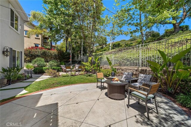 23478 Ridgeway, Mission Viejo, CA 92692 - view of patio / terrace with an outdoor fire pit and a fenced backyard