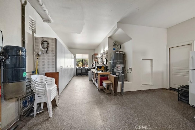 23478 Ridgeway, Mission Viejo, CA 92692 - garage featuring secured water heater and freestanding refrigerator