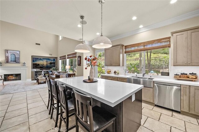23478 Ridgeway, Mission Viejo, CA 92692 - kitchen featuring dishwasher, a sink, open floor plan, light countertops, and a center island