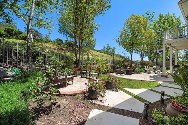 23478 Ridgeway, Mission Viejo, CA 92692 - fenced backyard with a patio area, an outdoor fire pit, and a balcony