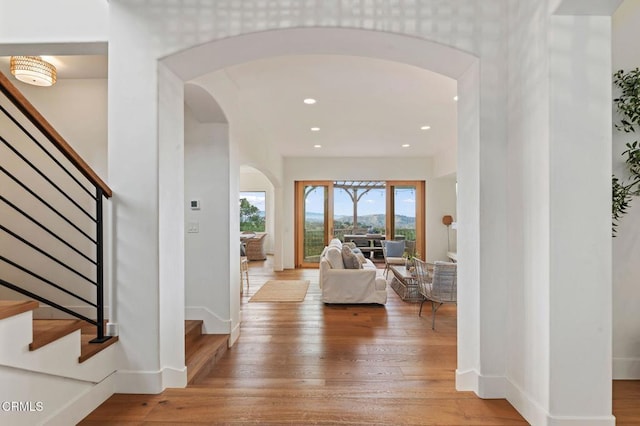 101 Via Tusa, Santa Barbara, CA 93105 - foyer with arched walkways, stairway, wood-type flooring, baseboards, and recessed lighting