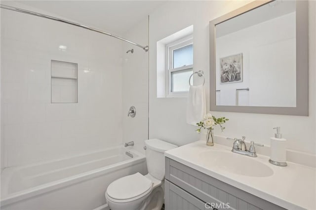 bathroom with toilet, vanity, and shower / bath combination
