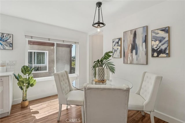 dining room with wood finished floors and baseboards