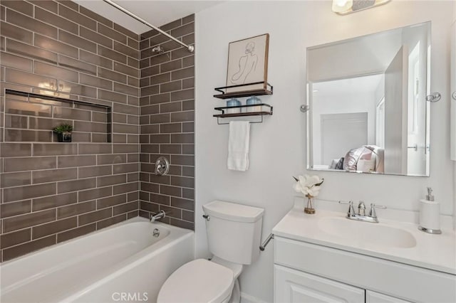 full bath featuring toilet, bathing tub / shower combination, and vanity