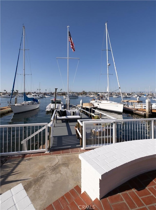 1436 W Bay Ave, Newport Beach, CA 92661 - view of patio / terrace with a water view, a dock, and view of marina