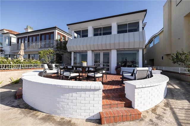 1436 W Bay Ave, Newport Beach, CA 92661 - back of property with french doors, a patio, and outdoor dining space