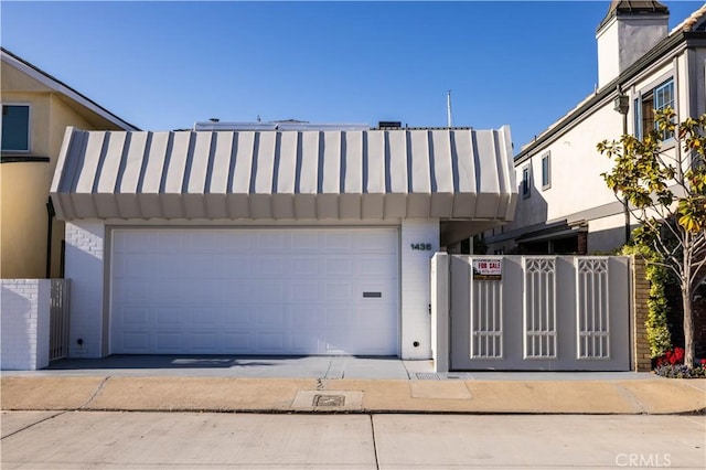 1436 W Bay Ave, Newport Beach, CA 92661 - view of front of house featuring a gate and a garage