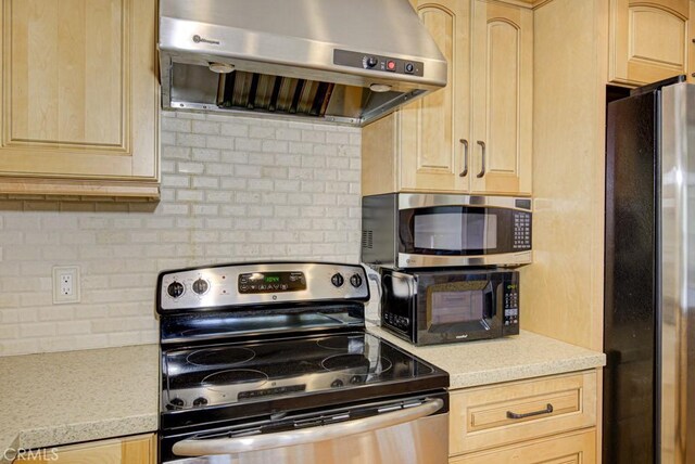 829 Via Alhambra Unit A, Laguna Woods, CA 92637 - kitchen featuring stainless steel appliances, extractor fan, and light brown cabinetry
