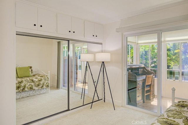 829 Via Alhambra Unit A, Laguna Woods, CA 92637 - doorway featuring light carpet, healthy amount of natural light, and baseboards