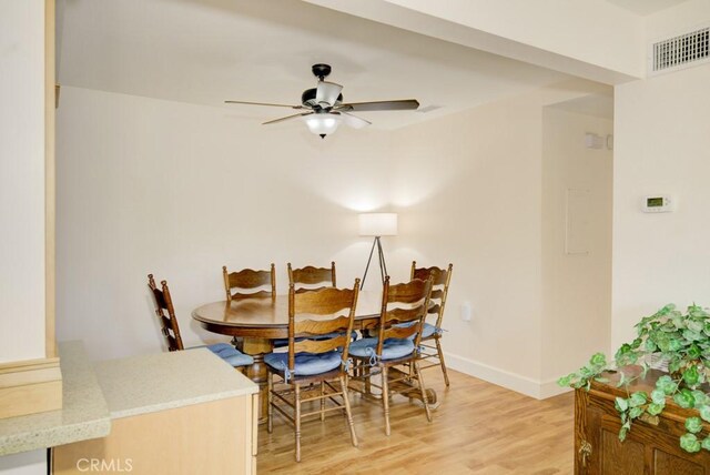 829 Via Alhambra Unit A, Laguna Woods, CA 92637 - dining area featuring light wood-style floors, baseboards, and ceiling fan