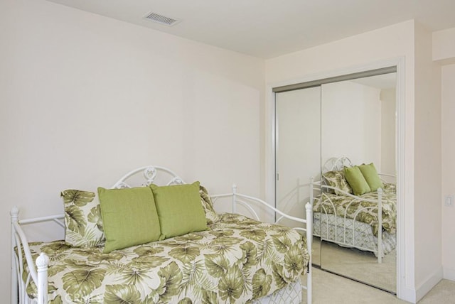 829 Via Alhambra Unit A, Laguna Woods, CA 92637 - bedroom with a closet, light colored carpet, and baseboards