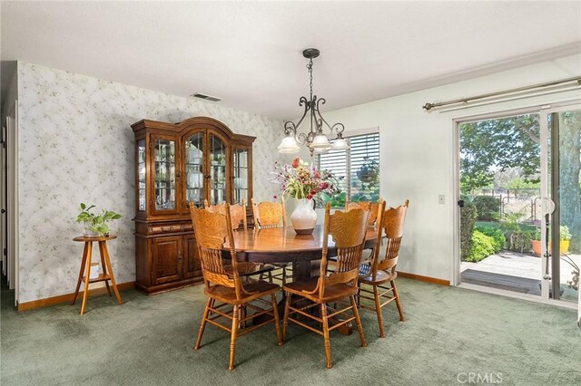 5456 Edith Ave, Corning, CA 96021 - dining space with wallpapered walls, baseboards, carpet, and a chandelier