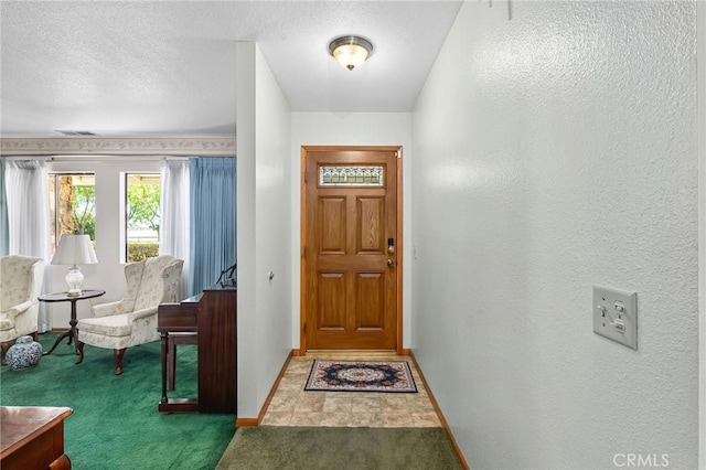 5456 Edith Ave, Corning, CA 96021 - entryway with carpet, baseboards, and a textured ceiling