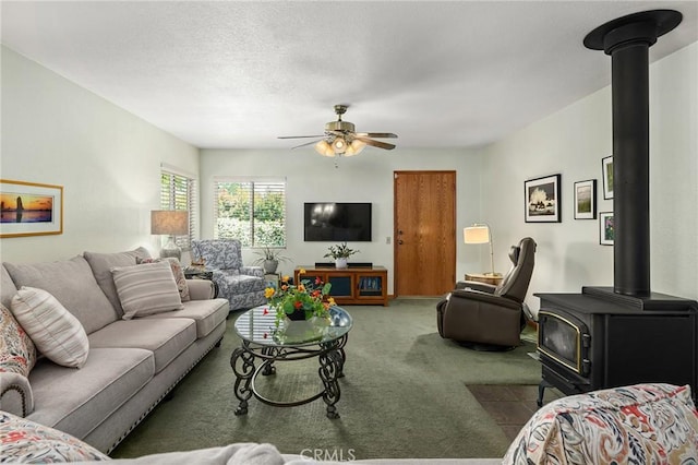 5456 Edith Ave, Corning, CA 96021 - living area with a wood stove, carpet, and a ceiling fan