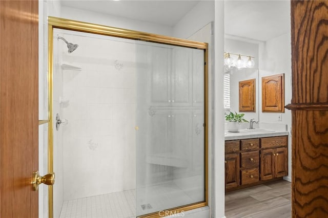 5456 Edith Ave, Corning, CA 96021 - bathroom featuring a shower stall, vanity, and wood finished floors