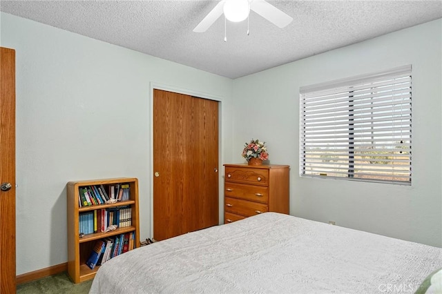 5456 Edith Ave, Corning, CA 96021 - carpeted bedroom featuring a closet, a textured ceiling, a ceiling fan, and baseboards