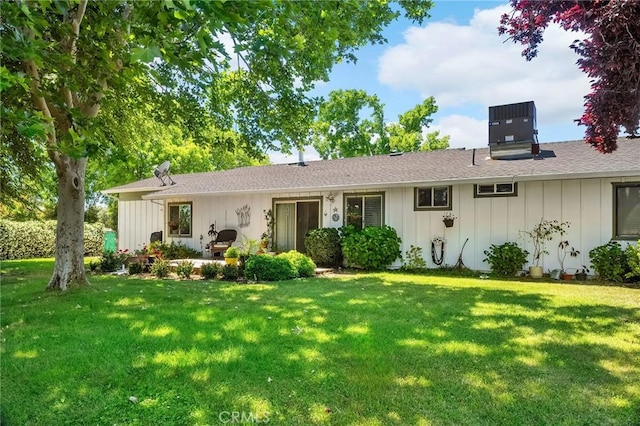5456 Edith Ave, Corning, CA 96021 - ranch-style house featuring board and batten siding, a front lawn, and cooling unit