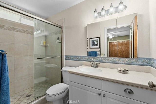 5456 Edith Ave, Corning, CA 96021 - full bath featuring a stall shower, vanity, toilet, and ceiling fan