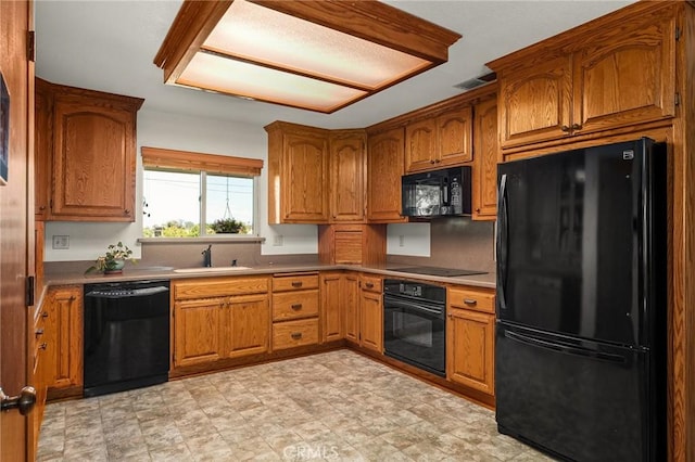 5456 Edith Ave, Corning, CA 96021 - kitchen featuring black appliances, a sink, and brown cabinetry