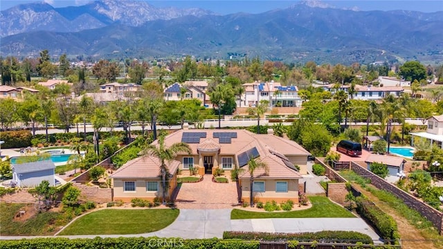 5799 Buckthorn Ave, Rancho Cucamonga, CA 91737 - aerial view of residential area with a pool area and a mountain backdrop