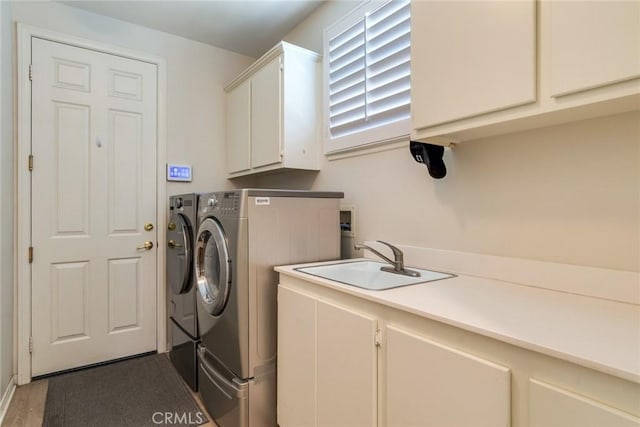 5799 Buckthorn Ave, Rancho Cucamonga, CA 91737 - laundry area featuring cabinet space, washing machine and dryer, and wood finished floors