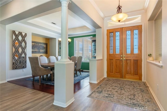 5799 Buckthorn Ave, Rancho Cucamonga, CA 91737 - entrance foyer featuring wood finished floors, decorative columns, baseboards, ornamental molding, and a tray ceiling