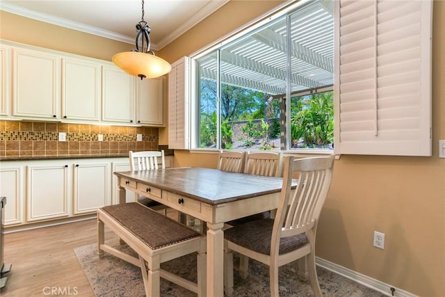 5799 Buckthorn Ave, Rancho Cucamonga, CA 91737 - dining area with ornamental molding, light wood finished floors, and baseboards