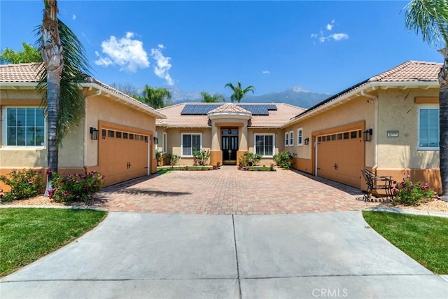 5799 Buckthorn Ave, Rancho Cucamonga, CA 91737 - view of front of house featuring a garage, decorative driveway, and stucco siding