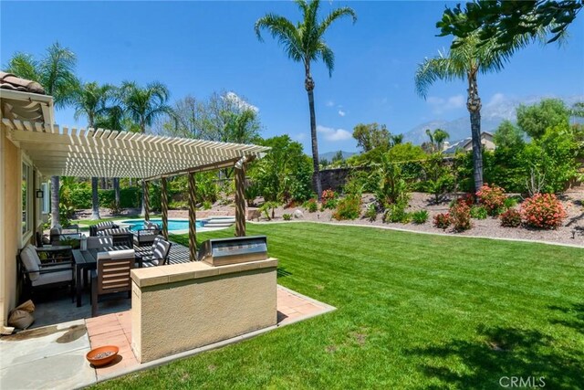 5799 Buckthorn Ave, Rancho Cucamonga, CA 91737 - view of grassy yard with a pergola, an outdoor pool, a patio, and an outdoor kitchen