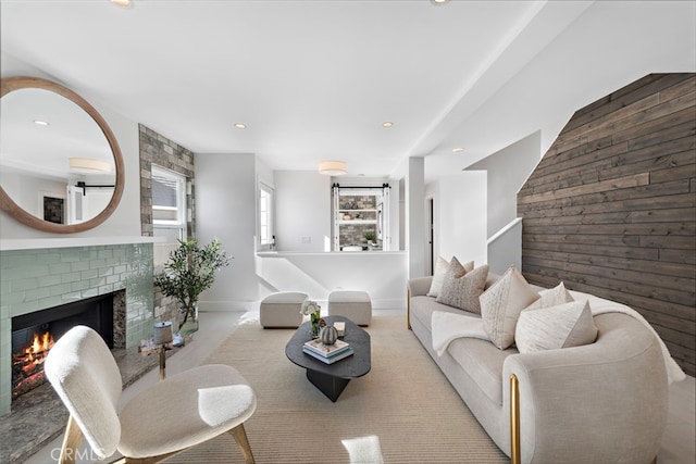 2 Hyannis, Laguna Niguel, CA 92677 - living area with a brick fireplace, wood walls, recessed lighting, baseboards, and carpet floors