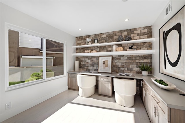 2 Hyannis, Laguna Niguel, CA 92677 - bar with light wood-style floors, baseboards, recessed lighting, and tasteful backsplash