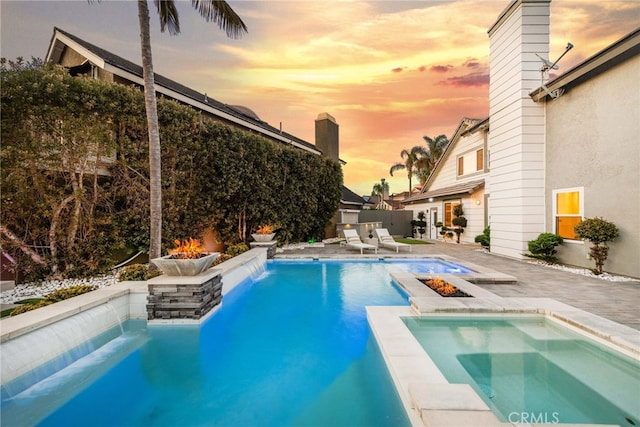 2 Hyannis, Laguna Niguel, CA 92677 - view of pool with an outdoor fire pit, a patio, a pool with connected hot tub, and fence