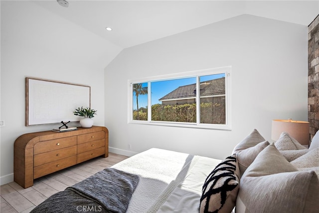 2 Hyannis, Laguna Niguel, CA 92677 - bedroom featuring lofted ceiling, light wood-style floors, and baseboards