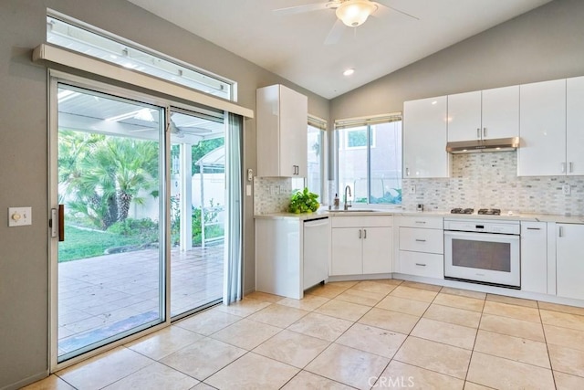 32364 Corte Coronado, Temecula, CA 92592 - kitchen featuring white appliances, backsplash, under cabinet range hood, vaulted ceiling, and ceiling fan