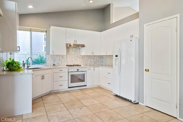 32364 Corte Coronado, Temecula, CA 92592 - kitchen featuring white appliances, a sink, under cabinet range hood, light countertops, and decorative backsplash