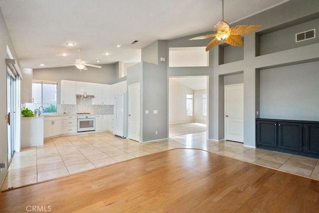 32364 Corte Coronado, Temecula, CA 92592 - unfurnished living room with a ceiling fan, light wood finished floors, a sink, baseboards, and recessed lighting