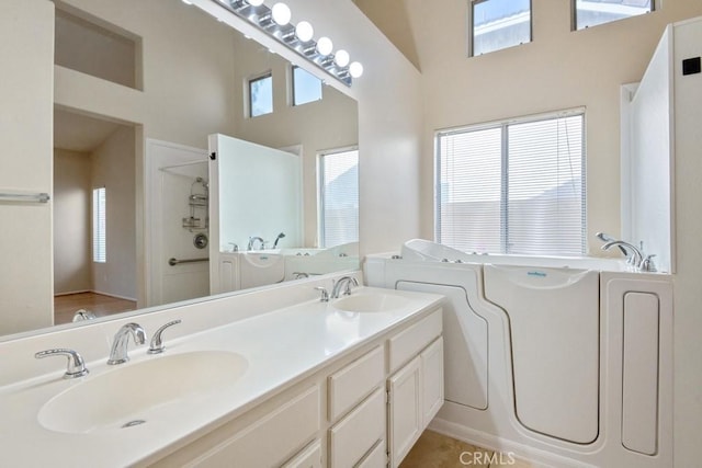 32364 Corte Coronado, Temecula, CA 92592 - bathroom featuring a towering ceiling, a garden tub, double vanity, and a shower