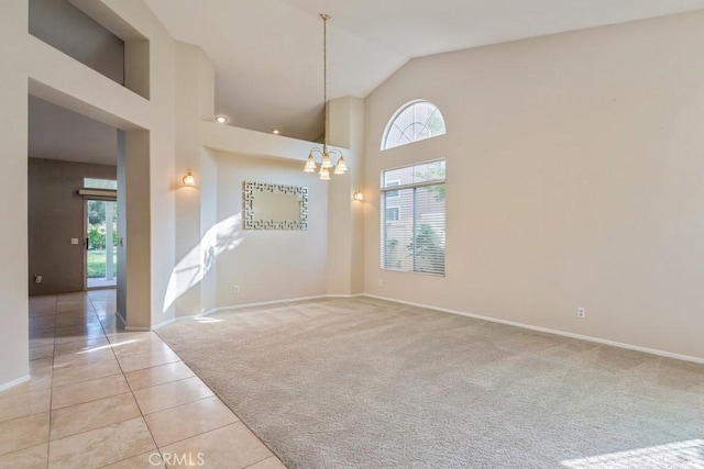 32364 Corte Coronado, Temecula, CA 92592 - unfurnished living room featuring a chandelier, baseboards, light carpet, light tile patterned flooring, and high vaulted ceiling