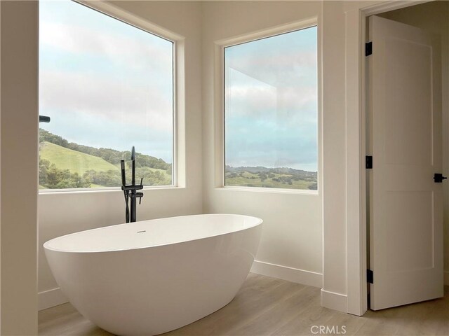 12460 San Marcos Rd, Atascadero, CA 93422 - bathroom with a freestanding bath and wood finished floors