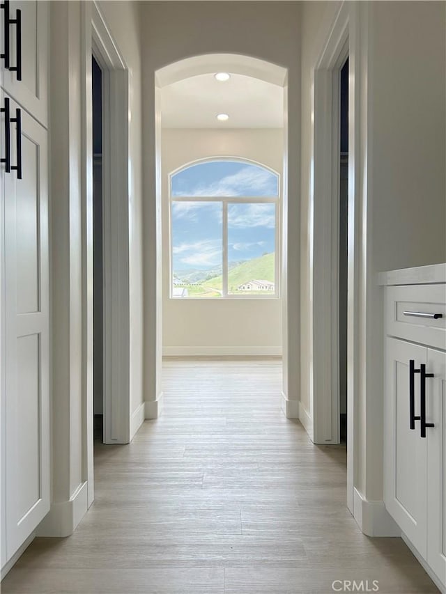 12460 San Marcos Rd, Atascadero, CA 93422 - corridor with light wood-type flooring and arched walkways